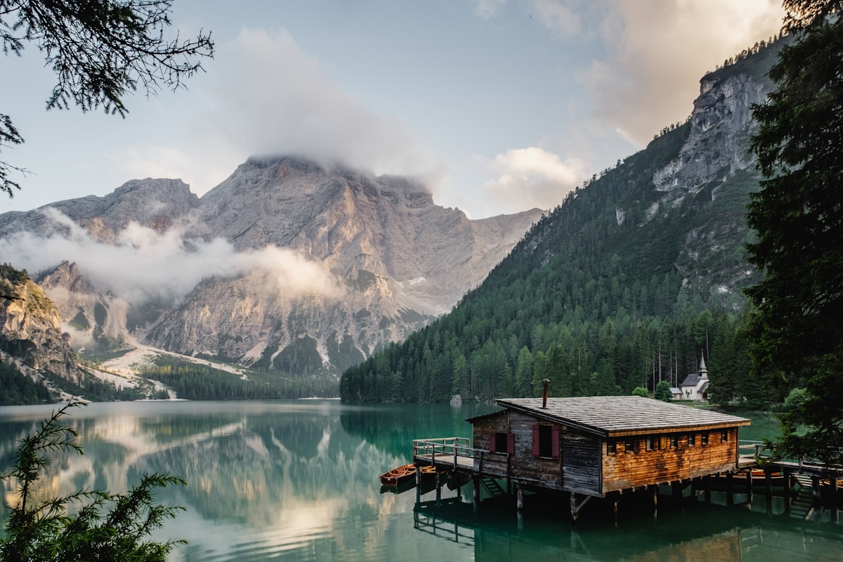 Freshwater Microplastics Accumulate Along Predictable Hydrological Gradients